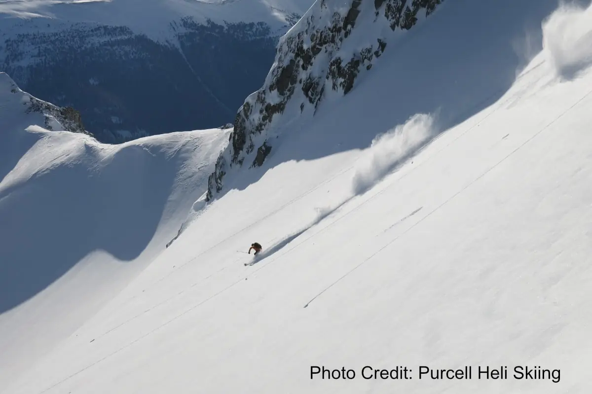 skier shredding powder in a bowl near Kicking Horse resort