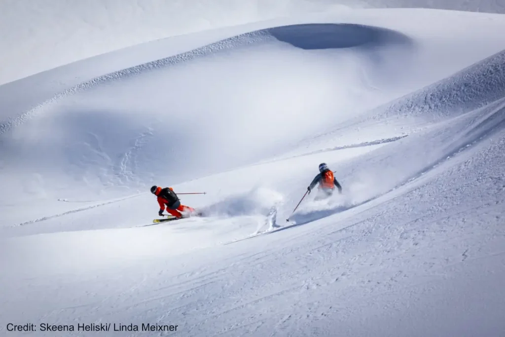 heli skiers in deep powder with Skeena Bearclaw tour