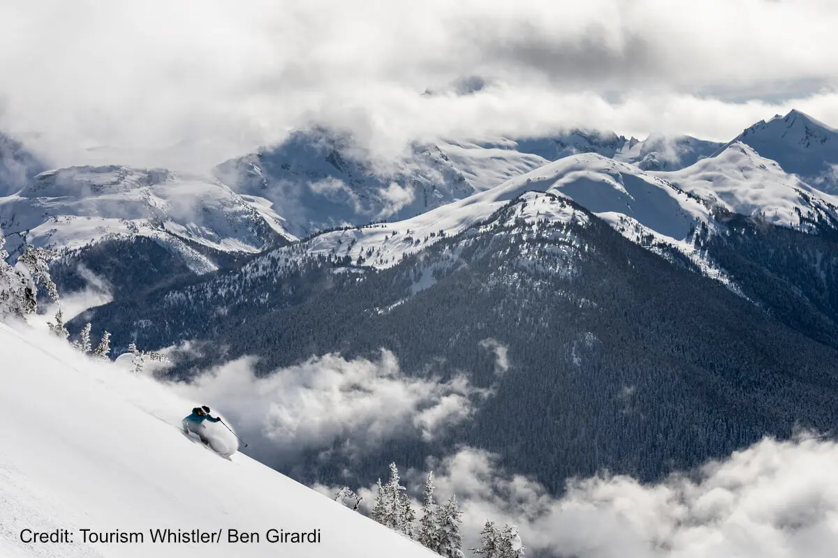 skier shredding powder atop Whistler Ski Resort