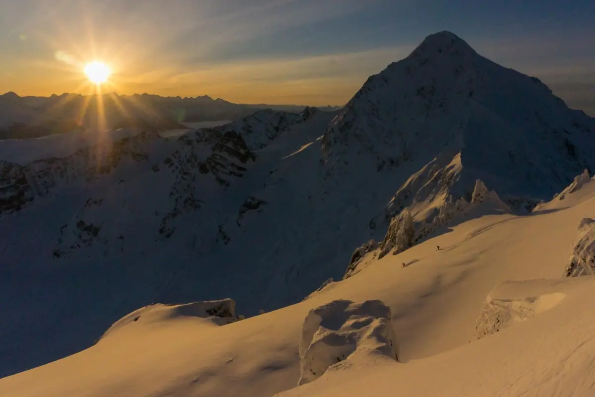 sun setting on 2 skiers in the Skeena Bearclaw backcountry