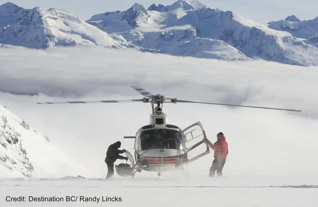 Whistler heliskiing helicopter dropping off skiers