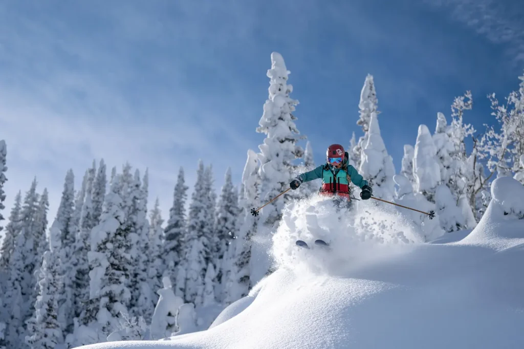 skier plowing through deep powder at Steamboat ski resort