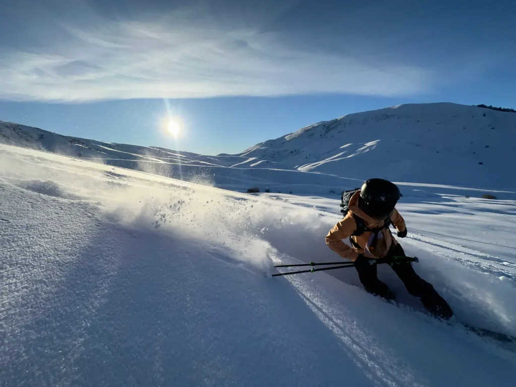 skier in deep powder in the Kazakhstan backcountry