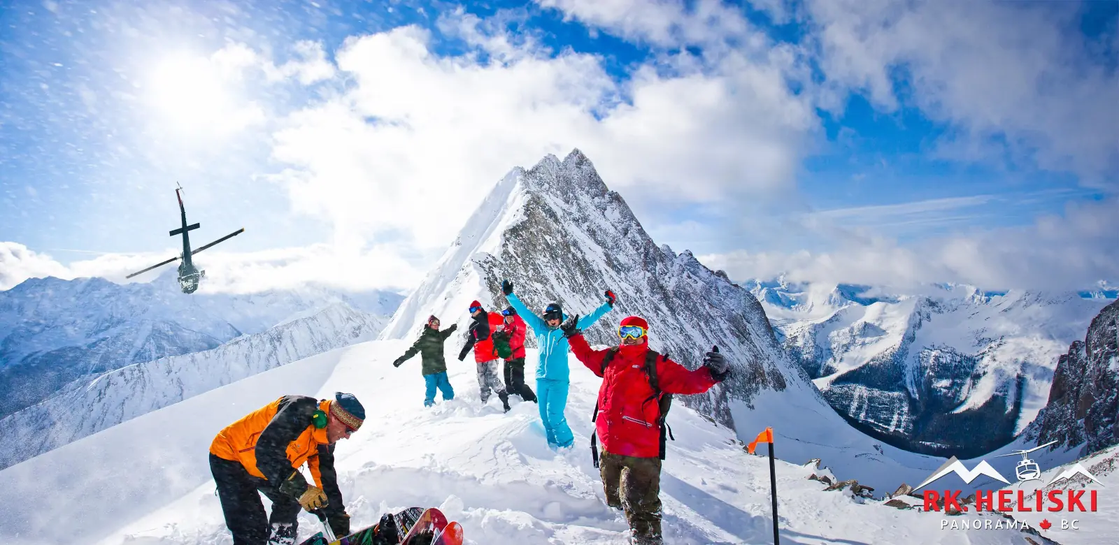 Heli skiers atop the mountains near Revelstoke