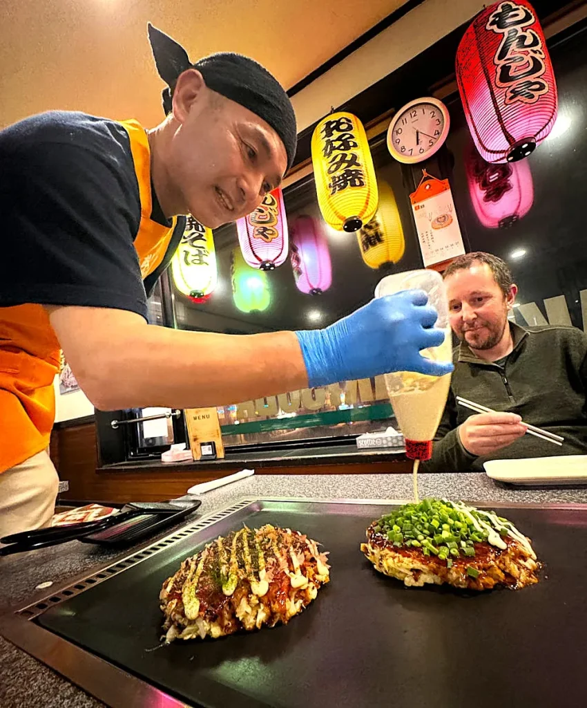 Nigel watching his meal be prepared in Japan