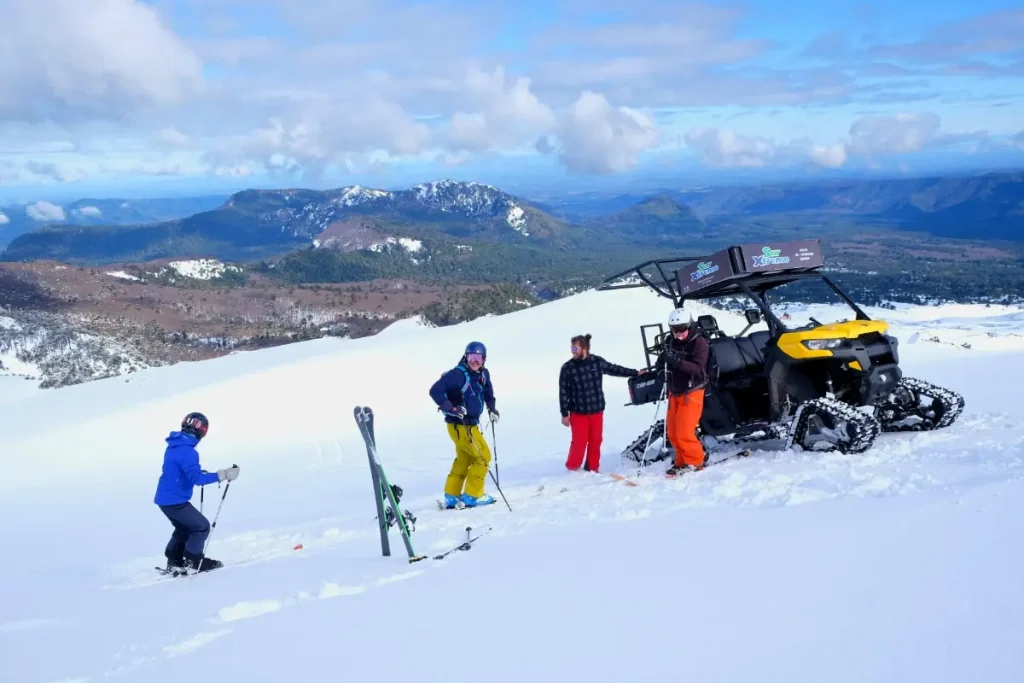 group of skiers boarding a snow machine for another run